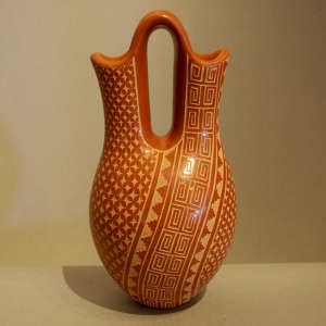 Sgraffito geometric design on a red wedding vase