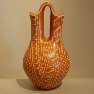Sgraffito geometric design on a red wedding vase
