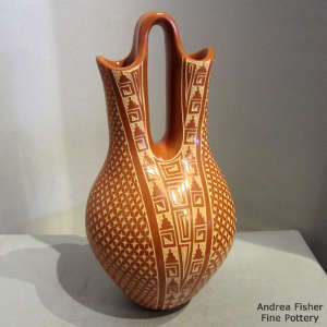 Sgraffito geometric design on a red wedding vase