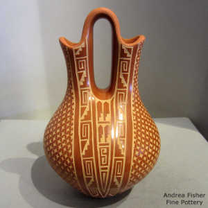 Sgraffito shard and geometric design on a red wedding vase