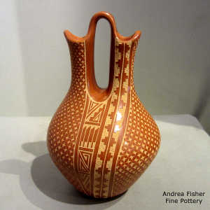 Sgraffito feather, kiva step and geometric design on a red wedding vase