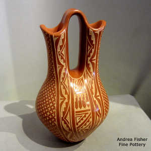 Sgraffito geometric design on a red wedding vase