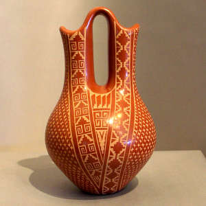Sgraffito geometric design on a red wedding vase