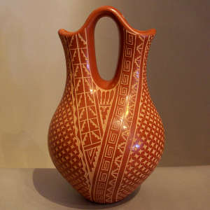 Sgraffito scroll, kiva step and geometric design on a red wedding vase