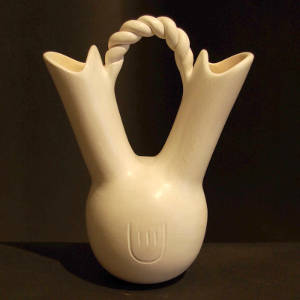 Twisted handle and bear paw imprint on a white wedding vase
