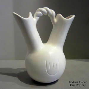 Bear paw imprint carved into a white wedding vase