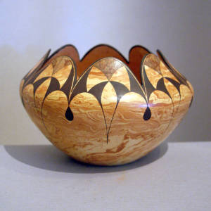 Cloud, fine line and geometric designs on a Mixed clay bowl with a scalloped rim