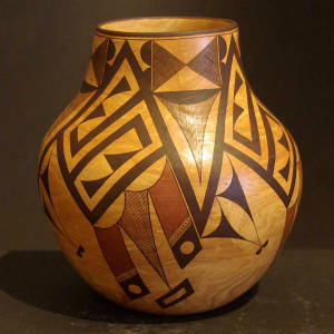Geometric designs on a polychrome Mixed clay jar