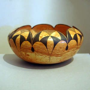 Scalloped rim and geometric designs on a Mixed clay jar