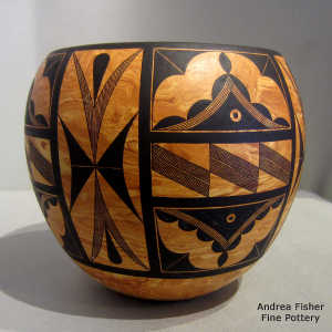 Black geometric design on a Mixed clay jar