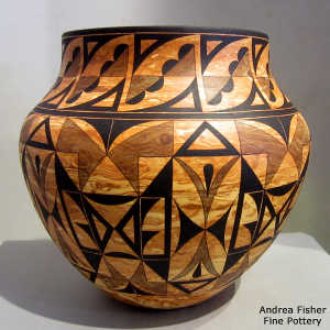 Black six-panel geometric design on a Mixed clay jar
