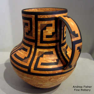 Black geometric design on a Mixed clay pitcher