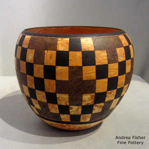 Checkerboard geometric design on a Mixed clay jar