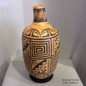 Fine line, kiva step, and spiral design on a marbleized clay jar