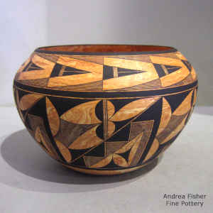 Black geometric design on a marbleized clay jar