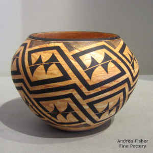 Black geometric design on a marbleized clay jar