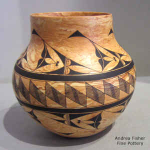 Black geometric design on a marbleized clay jar