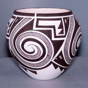 Fine line, spiral and geometric design on a black and white jar