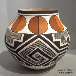 Fine line and geometric design on a polychrome jar