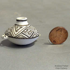 Geometric design on a miniature black and white jar