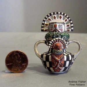 3 lids, 4 faces and double handles on a miniature figure
