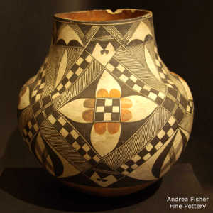 Fine line, medallion and geometric design on a polychrome jar by an unknown Laguna Pueblo potter