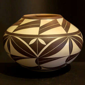 Dark brown geometric design on a cream jar