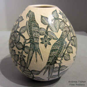 Sgraffito flower and parrot design on a polychrome jar
