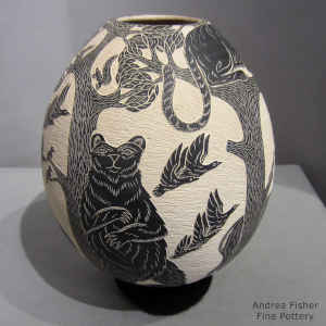 Black and white jar with sgraffito wildlife and nature design