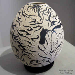 Black and white jar with sgraffito wildlife and geometric design