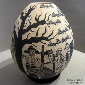 Sgraffito Day of the Dead motif on a black and white jar