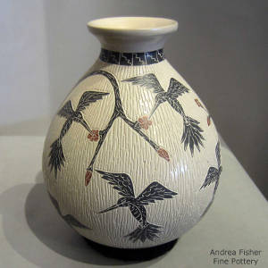 Sgraffito and painted floral and hummingbird motif on a polychrome jar