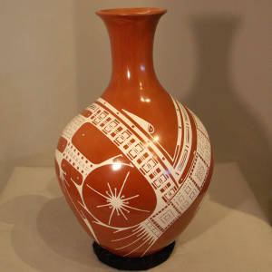 White geometric design on a long neck red vase