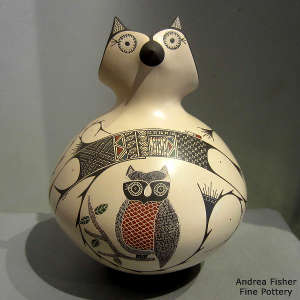 Owl, branch and geometric design on a polychrome owl figure