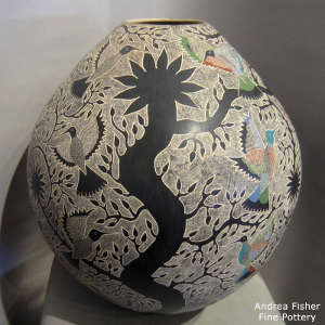 Sgraffito hummingbird and branch design on a large polychrome jar