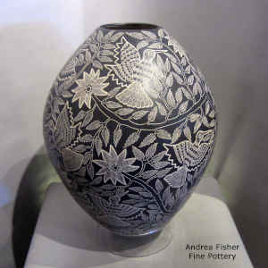 Sgraffito bird, branch and flower design on a large black and white jar
