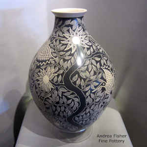 Sgraffito bird, branch and flower design on a large black and white jar