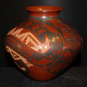 Painted and sgraffito geometric designs on a red jar