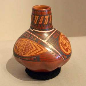 Sgraffito and painted geometric design on a polychrome vase