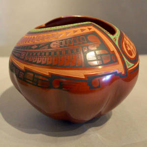 Sgraffito and painted geoemtric design on a polychrome melon-ribbed jar with an organic opening