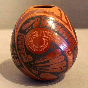 Sgraffito and painted geometric design on a polychrome jar