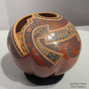 Sgraffito and painted geometric design ona melon-ribbed polychrome jar