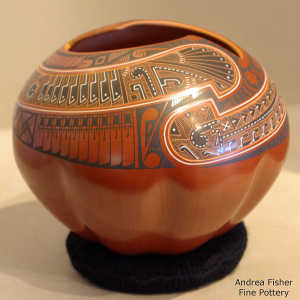 Sgraffito and painted geometric design on a melon-ribbed polychrome jar
