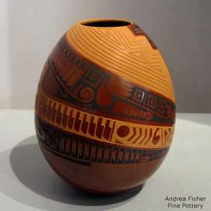 Sgraffito and painted fine line and geometric design on a polychrome jar