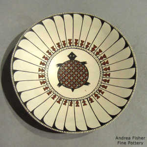 Turtle and geometric design on a polychrome plate