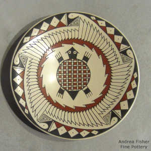 Polychrome plate with turtle and geometric design