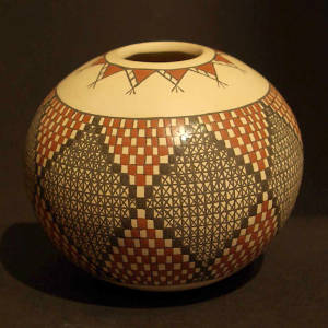 Checkerboard and geometric designs on a polychrome seedpot