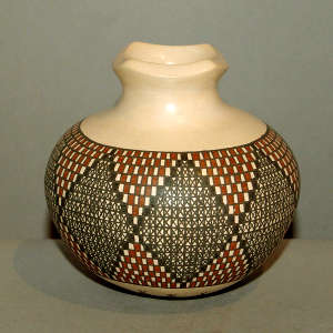 Squarish rim and geometric design on a polychrome jar