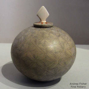 Fine line geometric design on a polychrome lidded jar