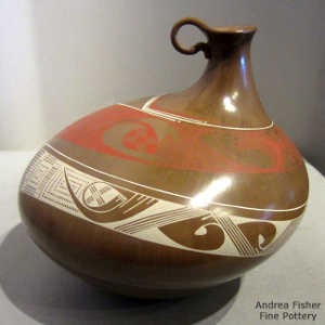 Bands of geometric design on a thin neck polychrome jar with a handle